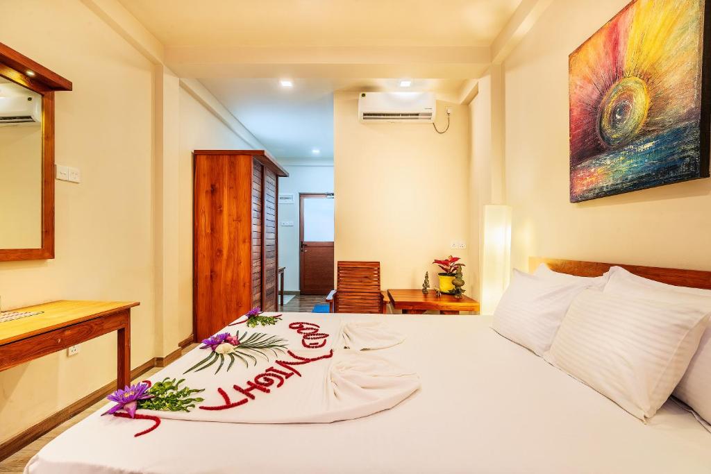 Postel nebo postele na pokoji v ubytování Hiru Hotel