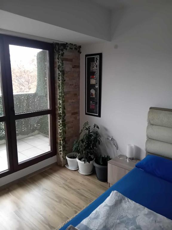 A bed or beds in a room at Park View Apartment Plovdiv with Parking