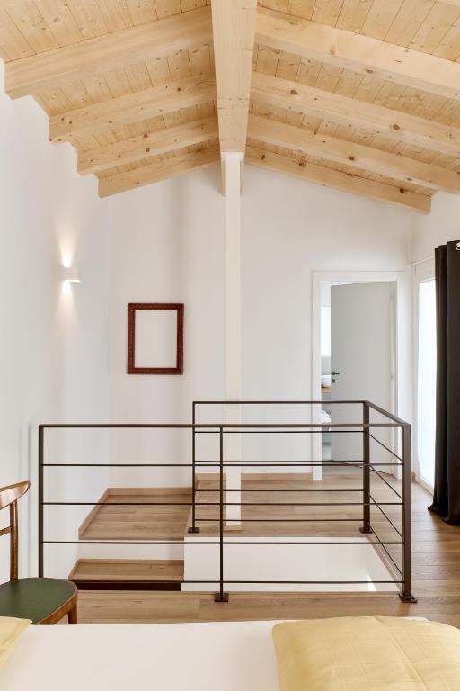 Postel nebo postele na pokoji v ubytování Corte Torchio B&B