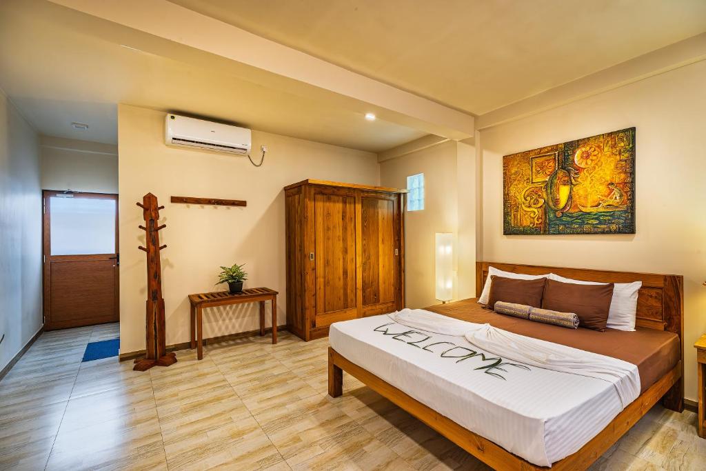 Postel nebo postele na pokoji v ubytování Hiru Hotel