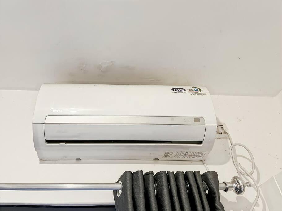 a toaster oven sitting on top of a counter at Cozy Studio Skyhouse Apt near ICE BSD with pool & Gym by 2ndHome in Cilenggang