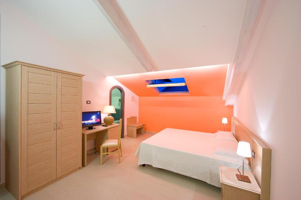 Postel nebo postele na pokoji v ubytování Sorrento Belvedere B&B