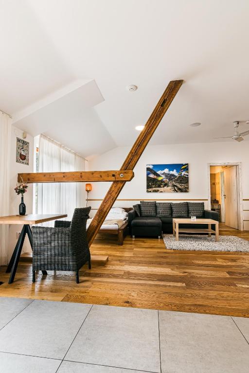 a living room with a couch and a table at Statek Samsara in Blansko
