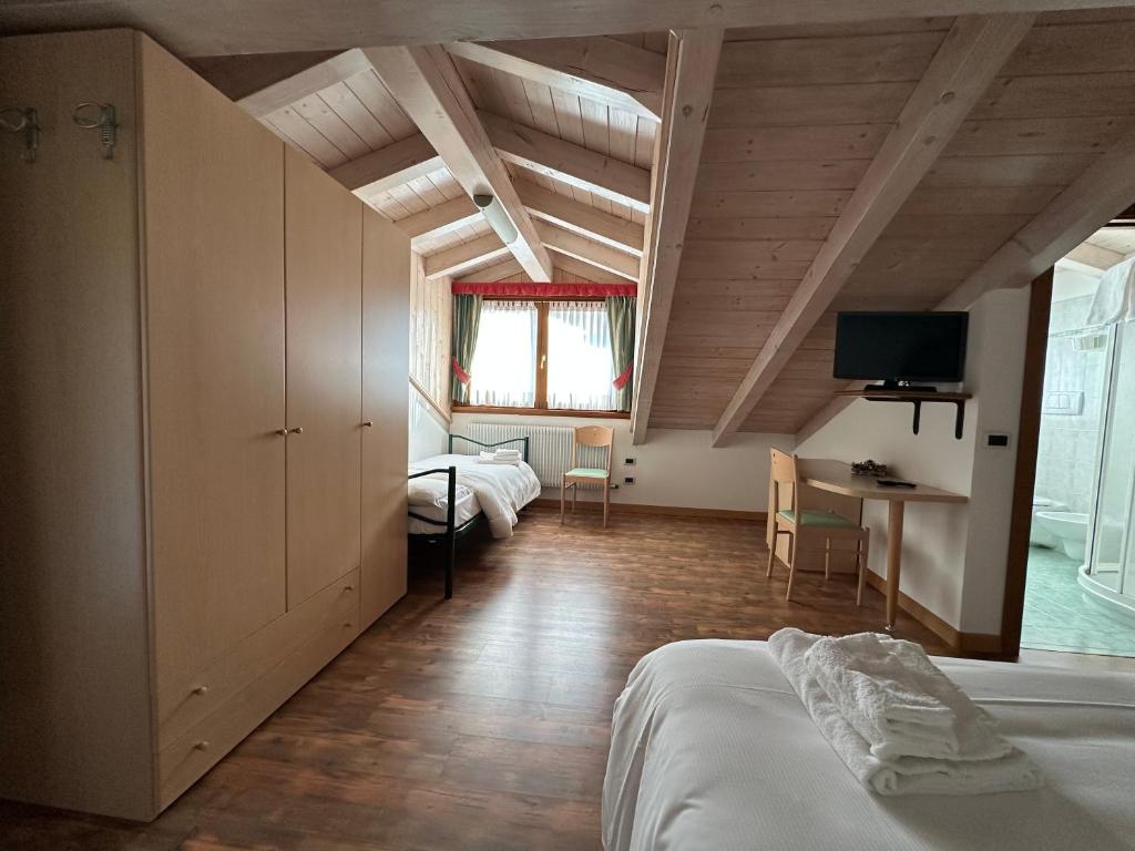 Postel nebo postele na pokoji v ubytování Hotel Garnì Maffei
