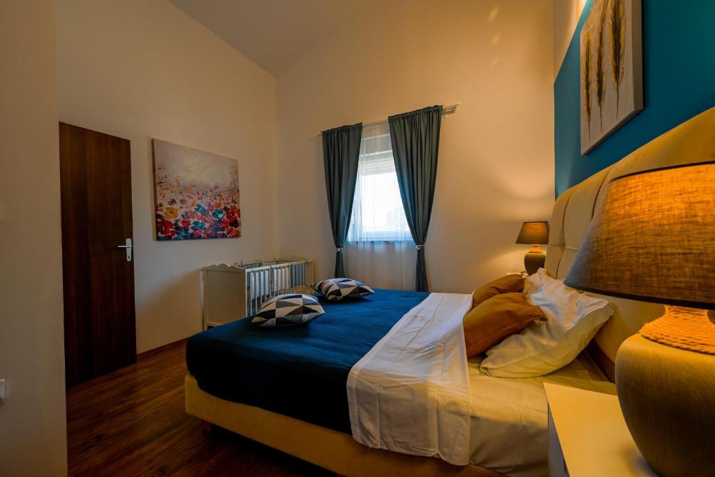 Postel nebo postele na pokoji v ubytování Villa Margherita