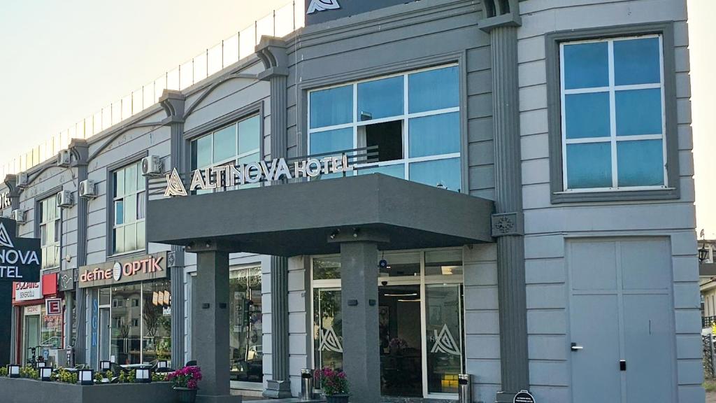 a building with a sign on the front of it at Altınova Hotel Sakarya in Serdivan
