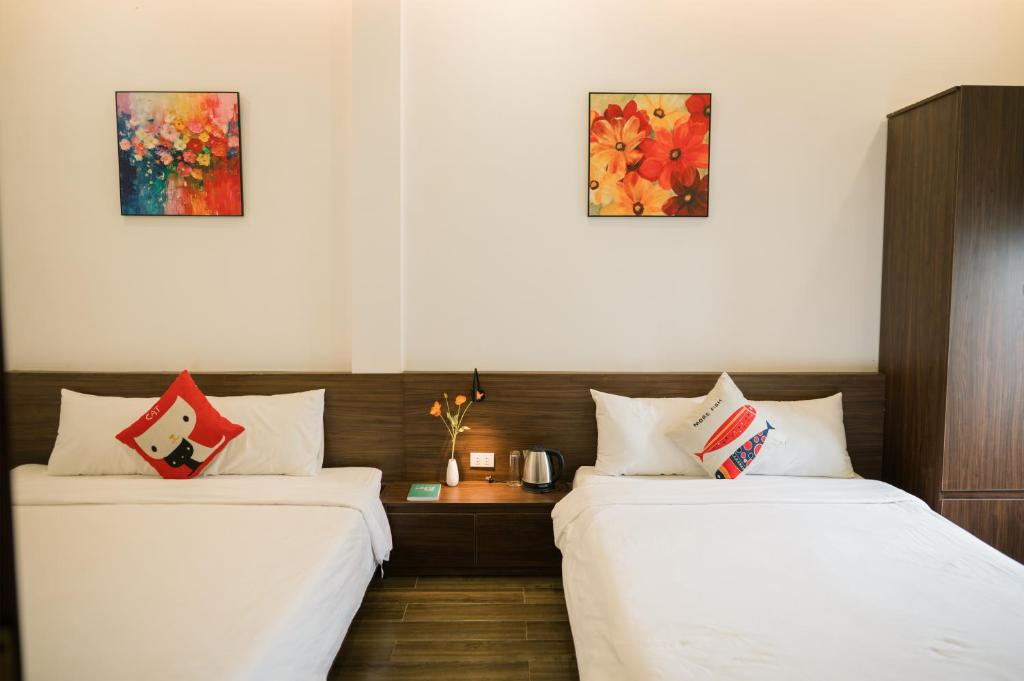 Giường trong phòng chung tại Như Ý Riverside Homestay