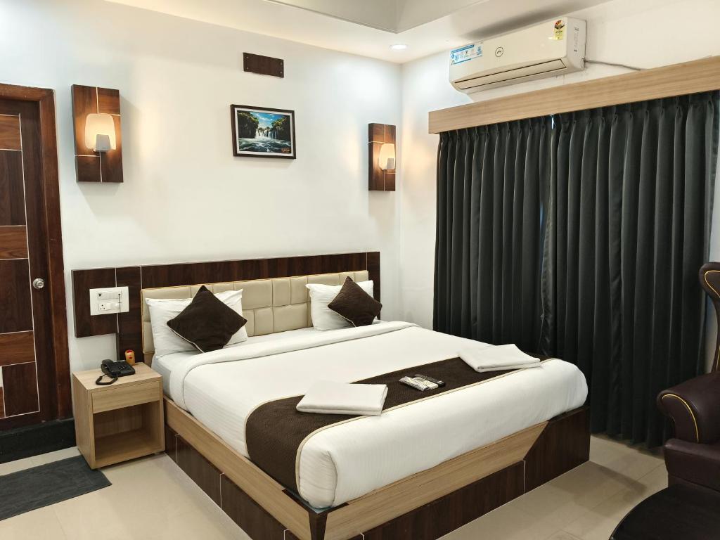 Postel nebo postele na pokoji v ubytování Hotel M S Pride