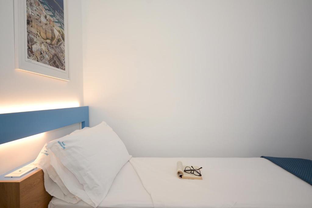 Postel nebo postele na pokoji v ubytování Hotel Miramare