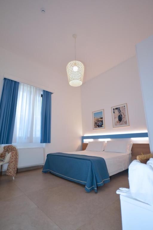 Postel nebo postele na pokoji v ubytování Hotel Miramare