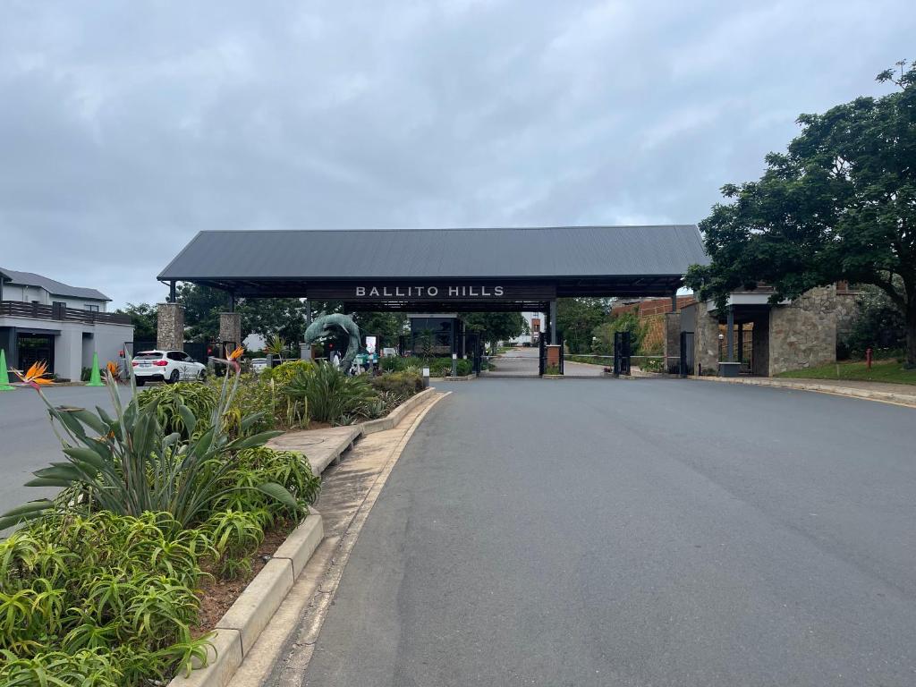 a gas station with a sign that reads banjo miles at Ballito Hills unit 350 in Ballito