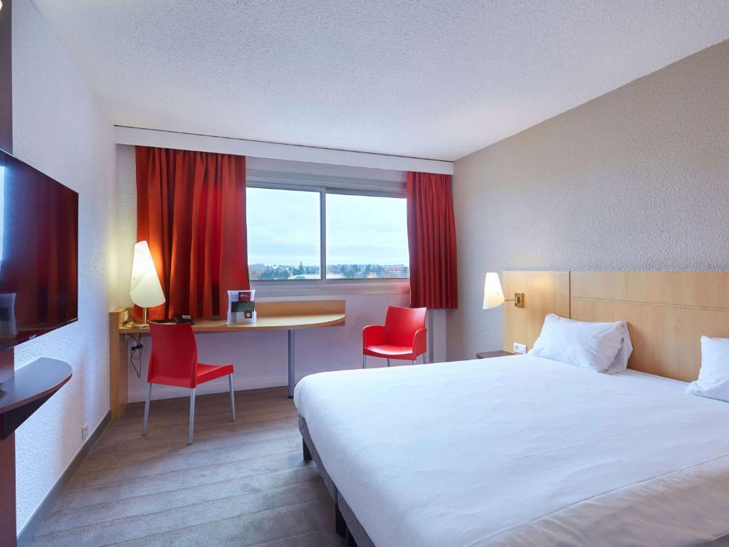 Postel nebo postele na pokoji v ubytování ibis Annemasse-Genève