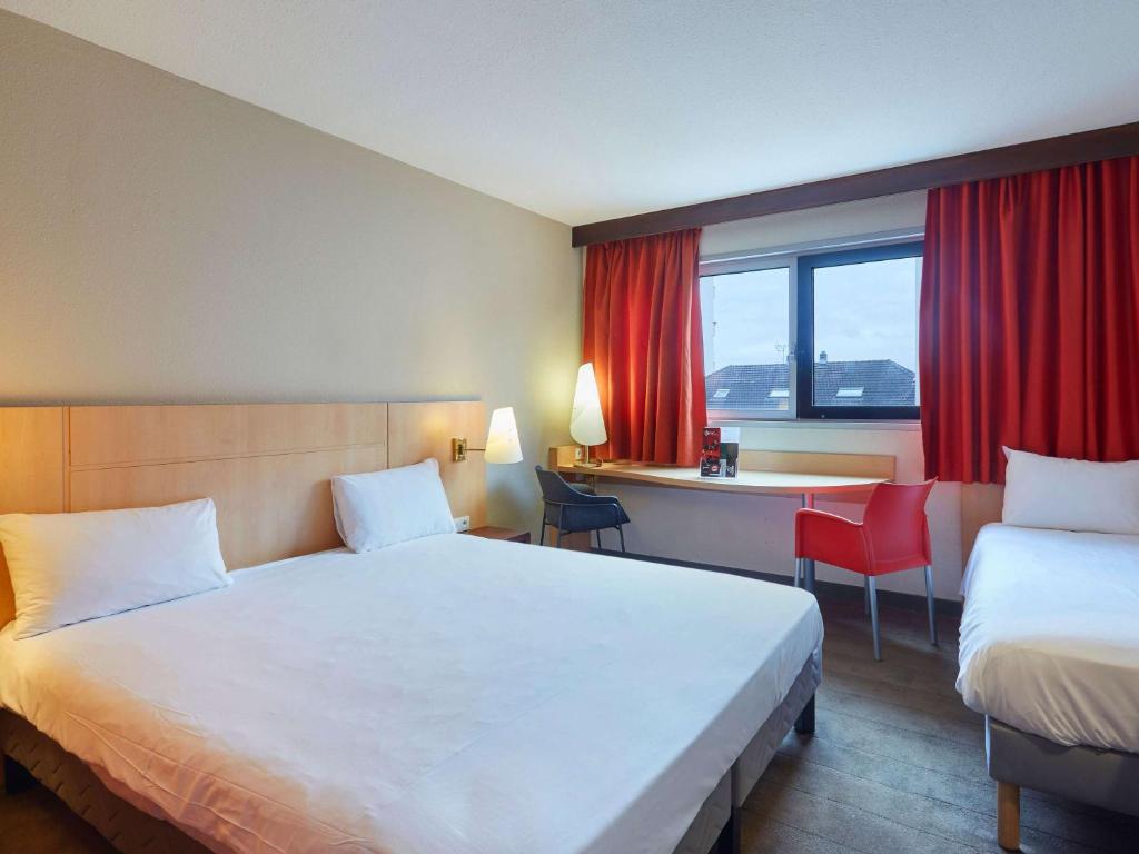Postel nebo postele na pokoji v ubytování ibis Annemasse-Genève