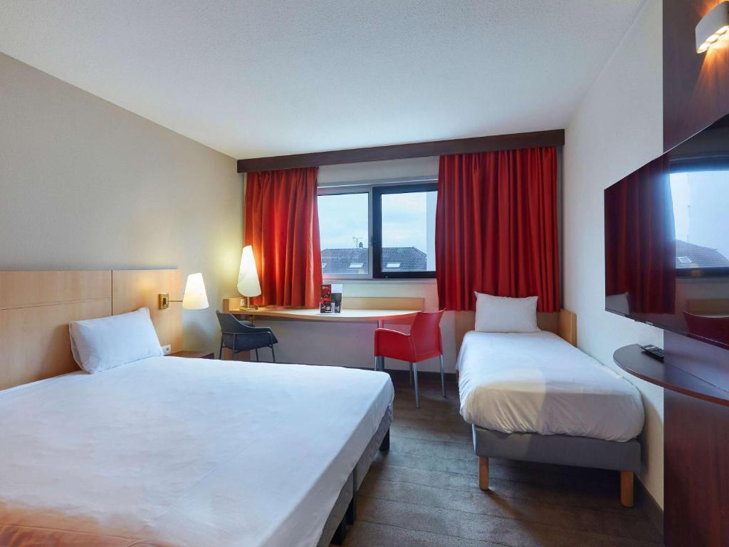 Postel nebo postele na pokoji v ubytování ibis Annemasse-Genève