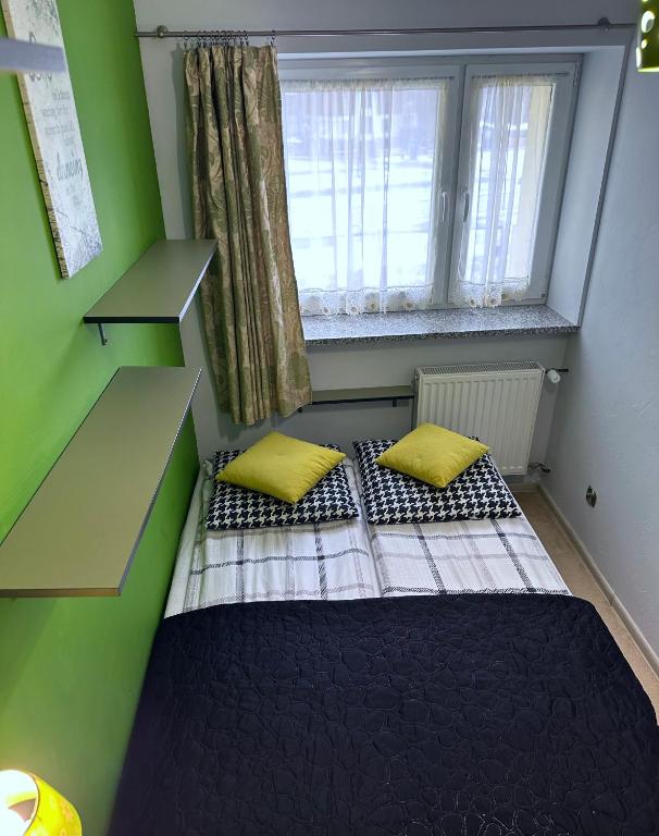 Posteľ alebo postele v izbe v ubytovaní APARTAMENT NAD KAMIEŃCZYKIEM II