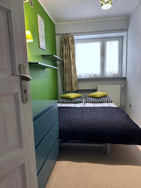 Posteľ alebo postele v izbe v ubytovaní APARTAMENT NAD KAMIEŃCZYKIEM II