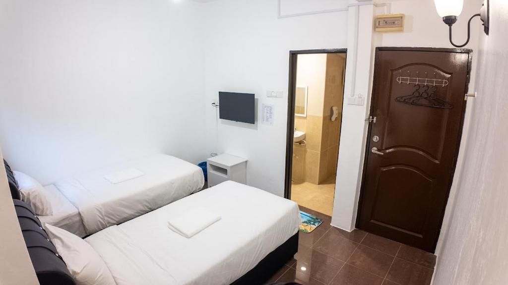 Postel nebo postele na pokoji v ubytování B Link Hotel