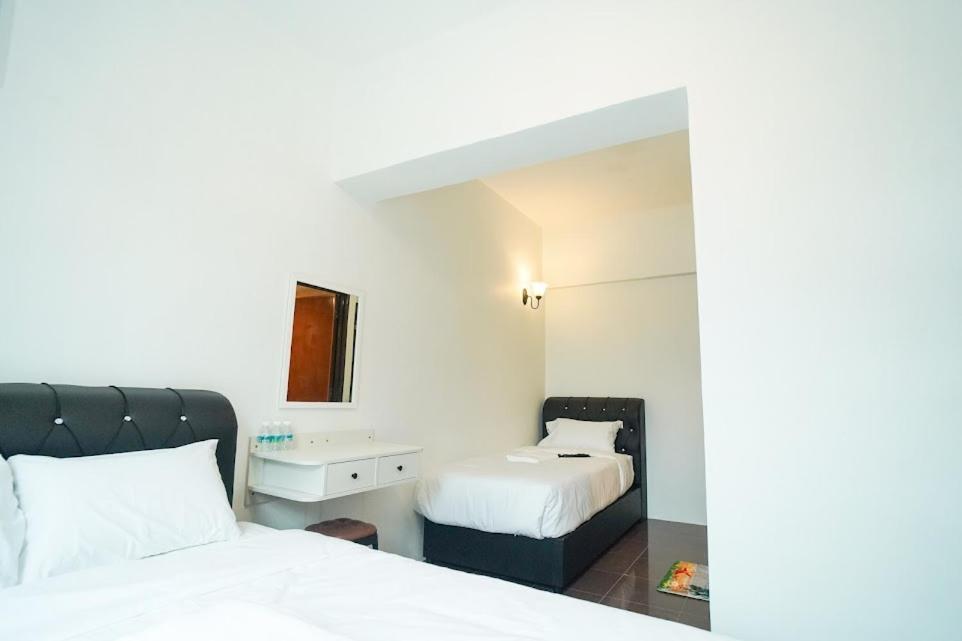 Postel nebo postele na pokoji v ubytování B Link Hotel