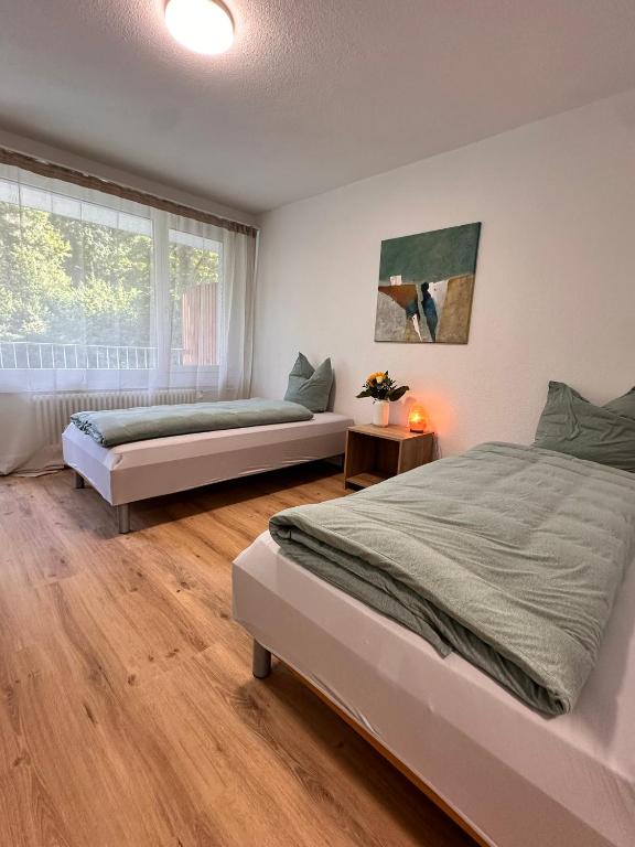 Postel nebo postele na pokoji v ubytování Business Hotel Riverside