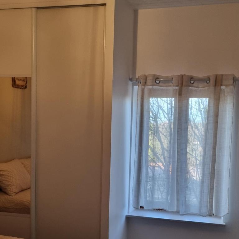 Postel nebo postele na pokoji v ubytování L'hirondelle