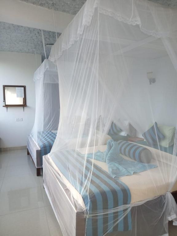 Postel nebo postele na pokoji v ubytování Sunray Homestay