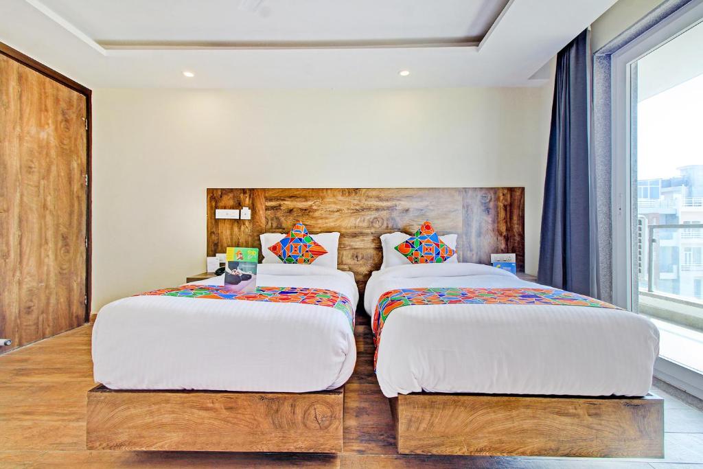 Postel nebo postele na pokoji v ubytování FabHotel Soft Petals