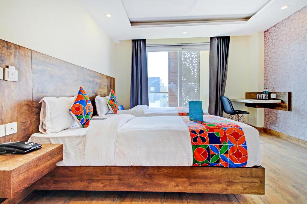 Postel nebo postele na pokoji v ubytování FabHotel Soft Petals