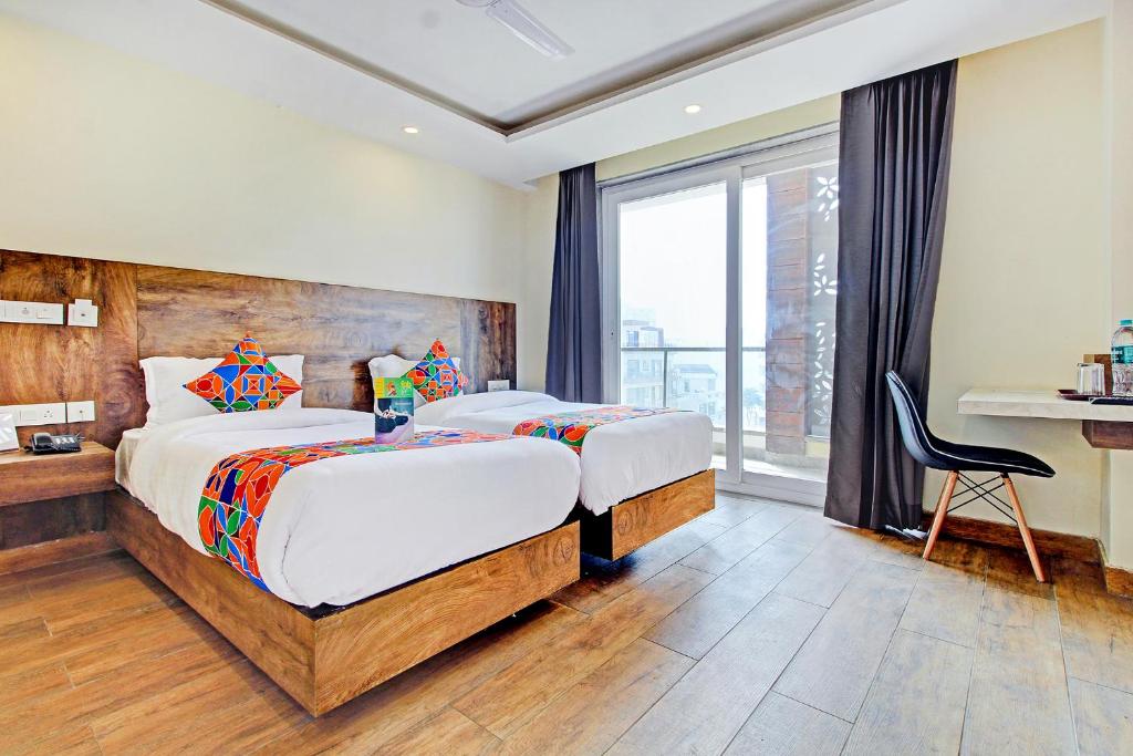 Postel nebo postele na pokoji v ubytování FabHotel Soft Petals