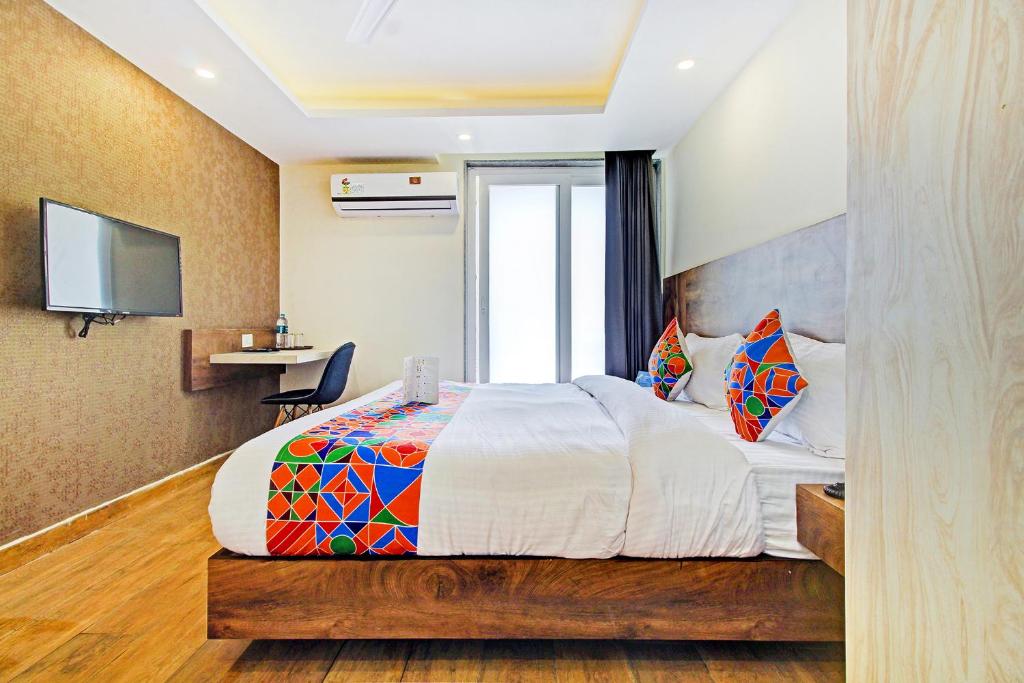 Postel nebo postele na pokoji v ubytování FabHotel Soft Petals