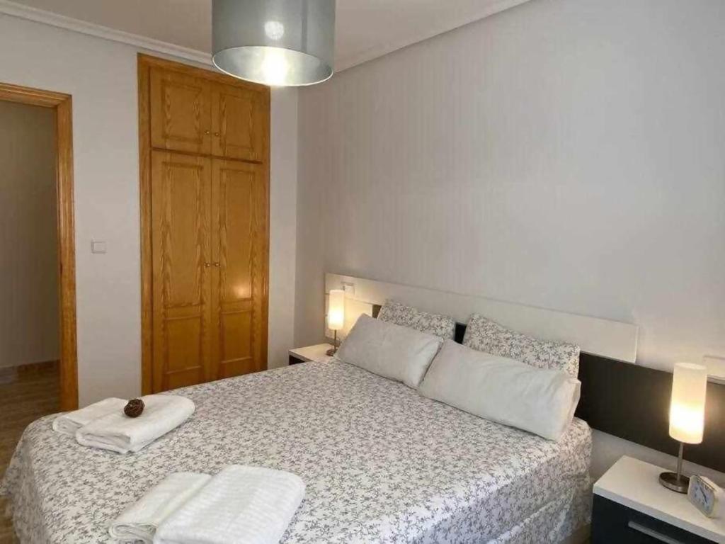 Postel nebo postele na pokoji v ubytování Acogedor apartamento a 200 m de la playa