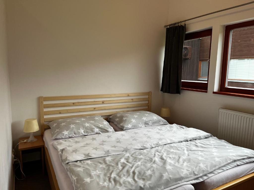 Postel nebo postele na pokoji v ubytování Apartmany Resort