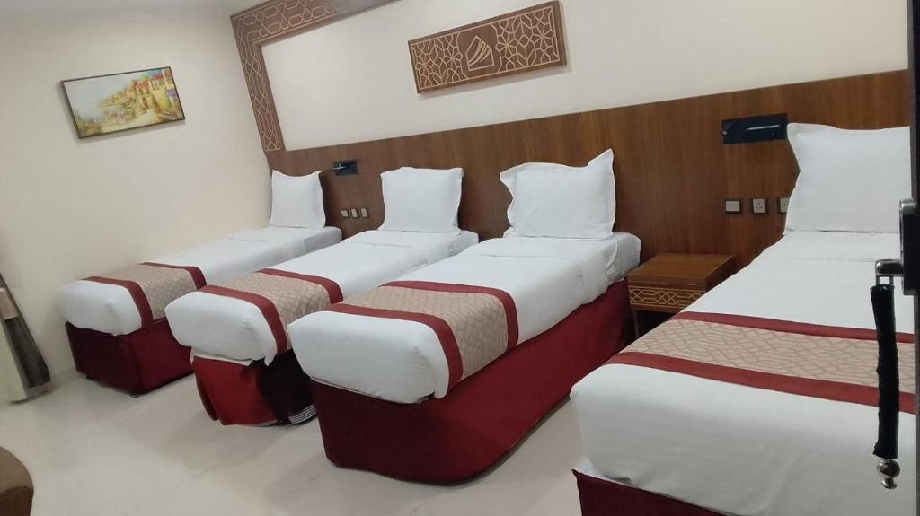Postel nebo postele na pokoji v ubytování Mahd Al Resala 3 Hotel - فندق مهد الرسالة 3