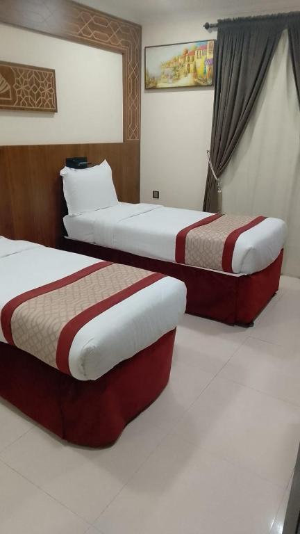 Postel nebo postele na pokoji v ubytování Mahd Al Resala 3 Hotel - فندق مهد الرسالة 3