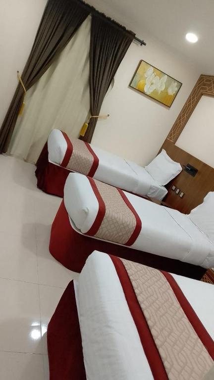 Postel nebo postele na pokoji v ubytování Mahd Al Resala 3 Hotel - فندق مهد الرسالة 3