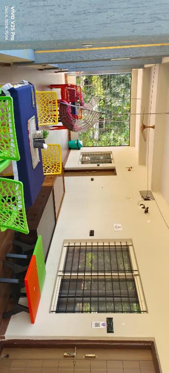 a view of a kitchen with a window at Saanvi Farmhouse in Hampi