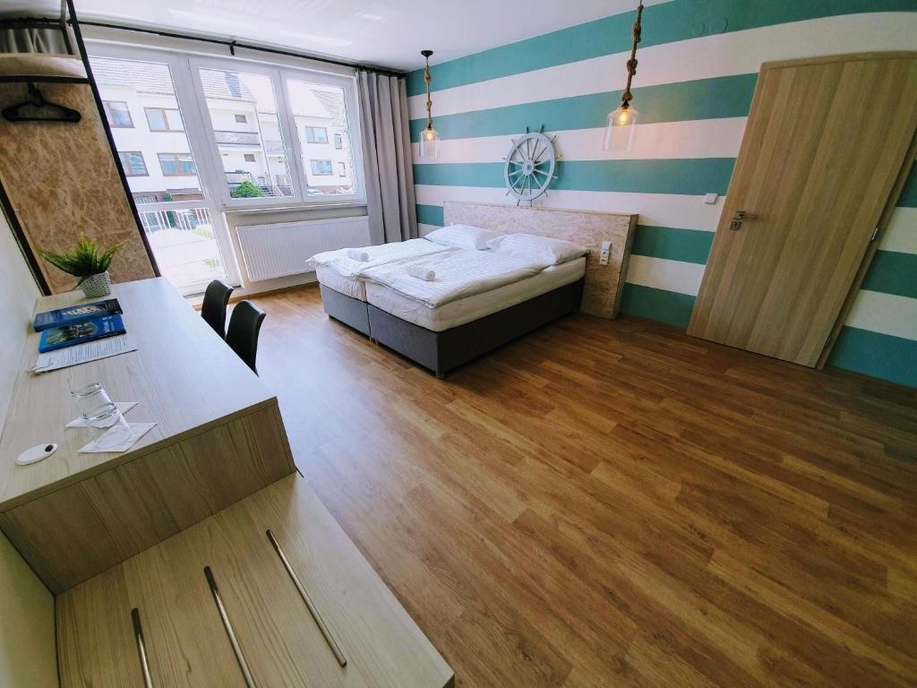 Postel nebo postele na pokoji v ubytování Apartmány Petrov, Baťův kanál