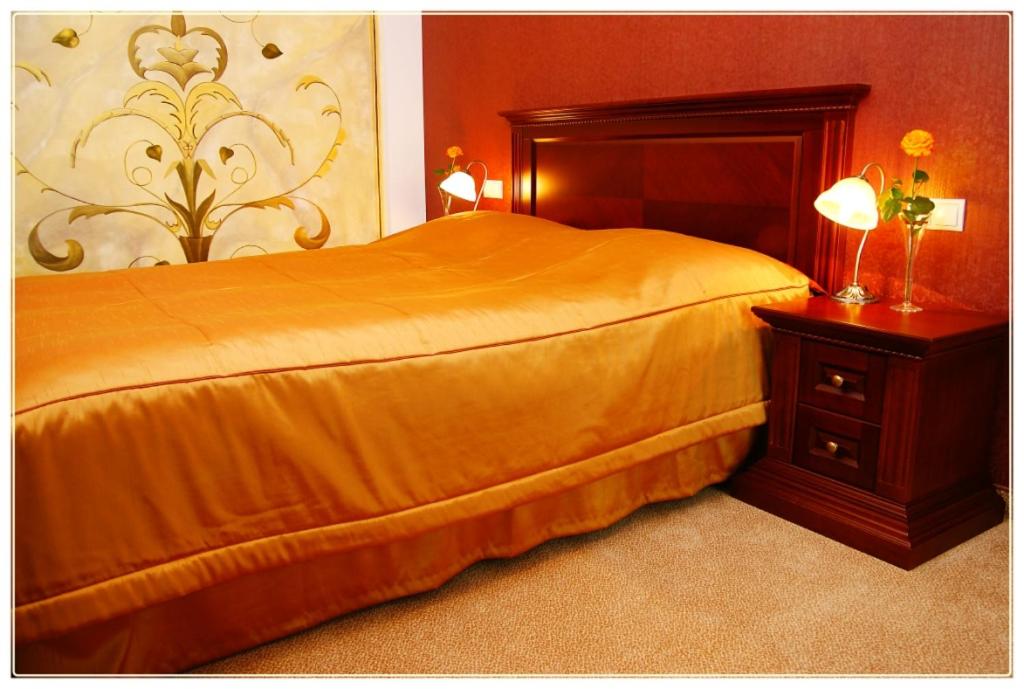 Postel nebo postele na pokoji v ubytování Hotel Fajkier