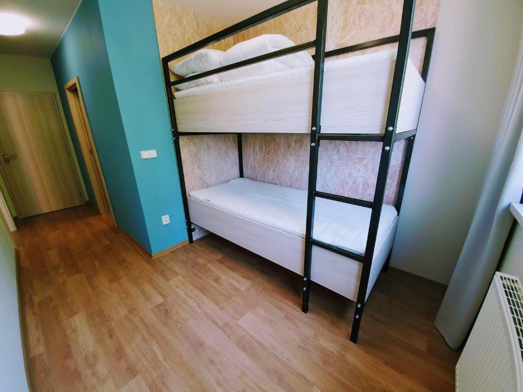 Postel nebo postele na pokoji v ubytování Apartmány Petrov, Baťův kanál