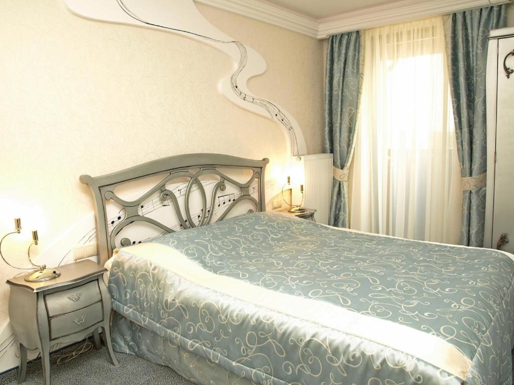 Postel nebo postele na pokoji v ubytování Hotel Fajkier