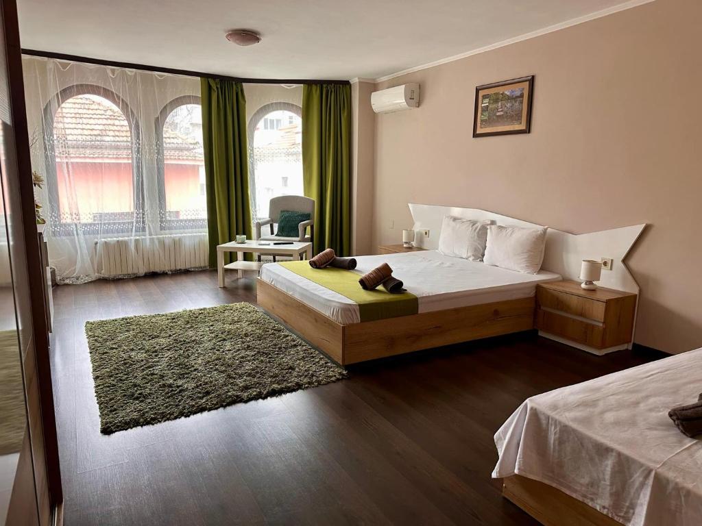 Postel nebo postele na pokoji v ubytování Hotel Oppium Restaurant & Garden