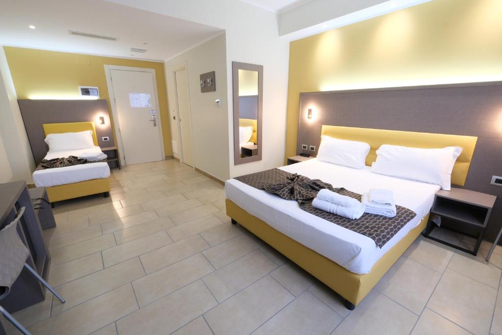Postel nebo postele na pokoji v ubytování Hotel Giacosa