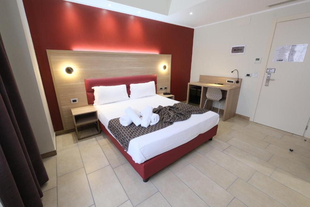 Postel nebo postele na pokoji v ubytování Hotel Giacosa