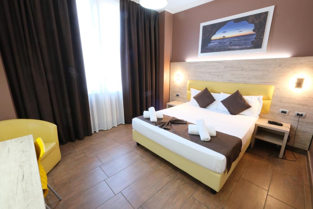 Postel nebo postele na pokoji v ubytování Hotel Giacosa