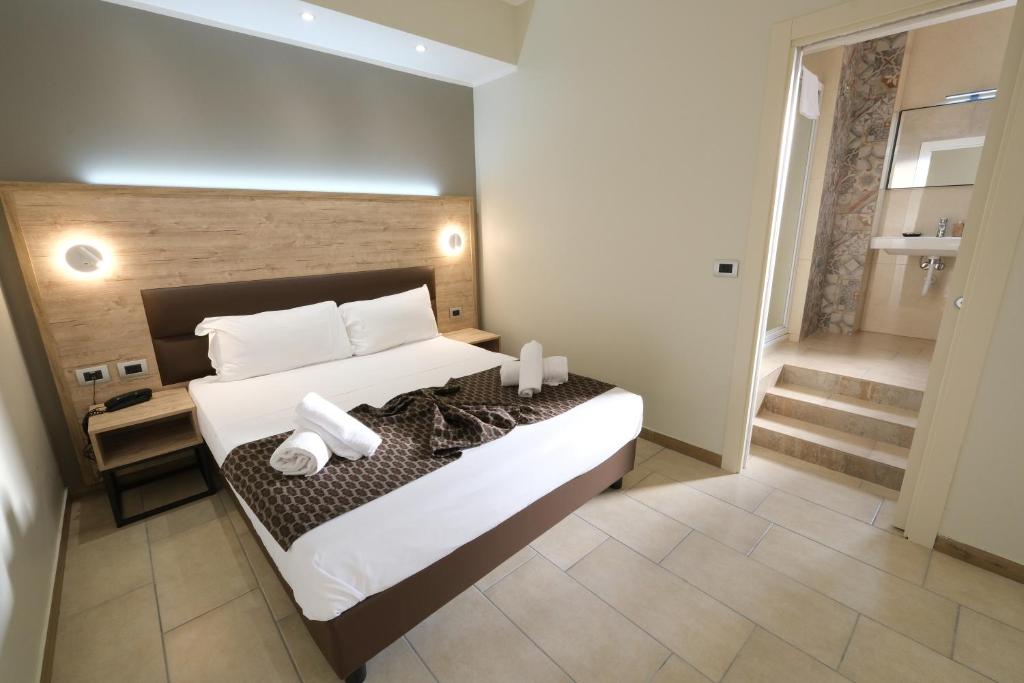 Postel nebo postele na pokoji v ubytování Hotel Giacosa