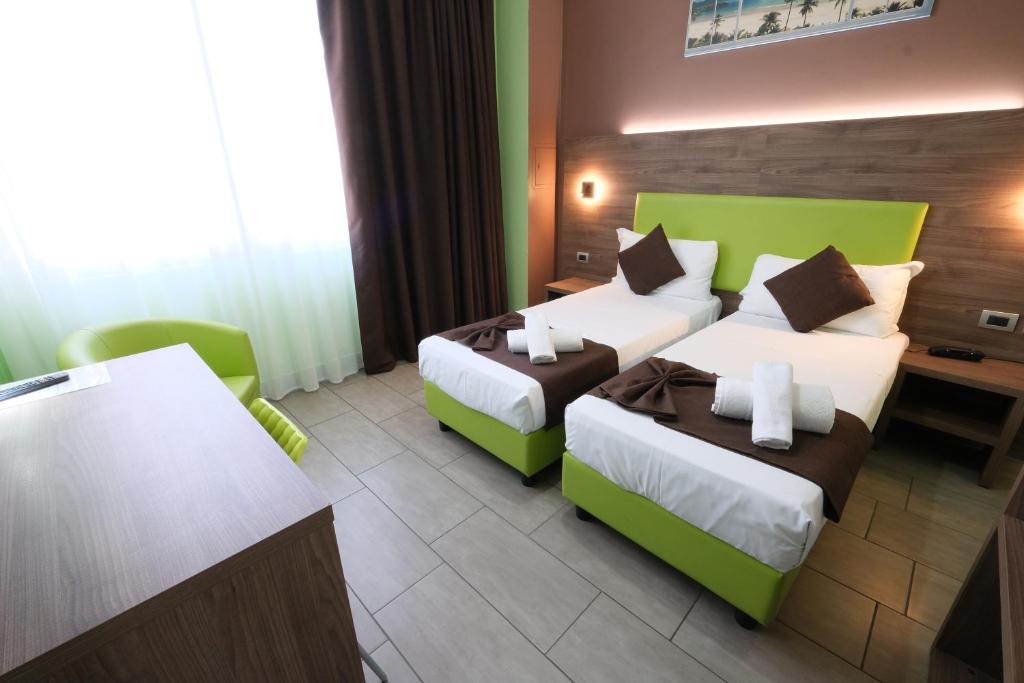 Postel nebo postele na pokoji v ubytování Hotel Giacosa