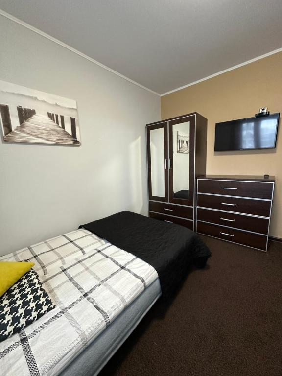 Posteľ alebo postele v izbe v ubytovaní APARTAMENT NAD KAMIEŃCZYKIEM II