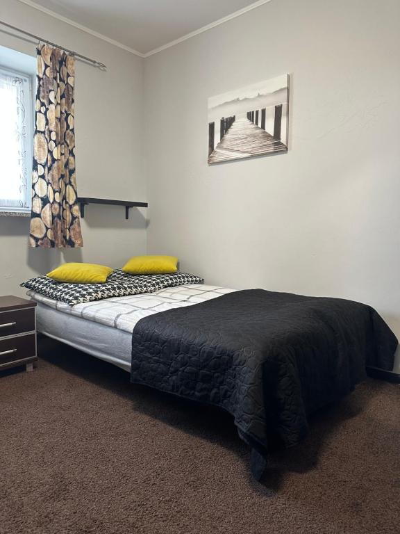 Posteľ alebo postele v izbe v ubytovaní APARTAMENT NAD KAMIEŃCZYKIEM II