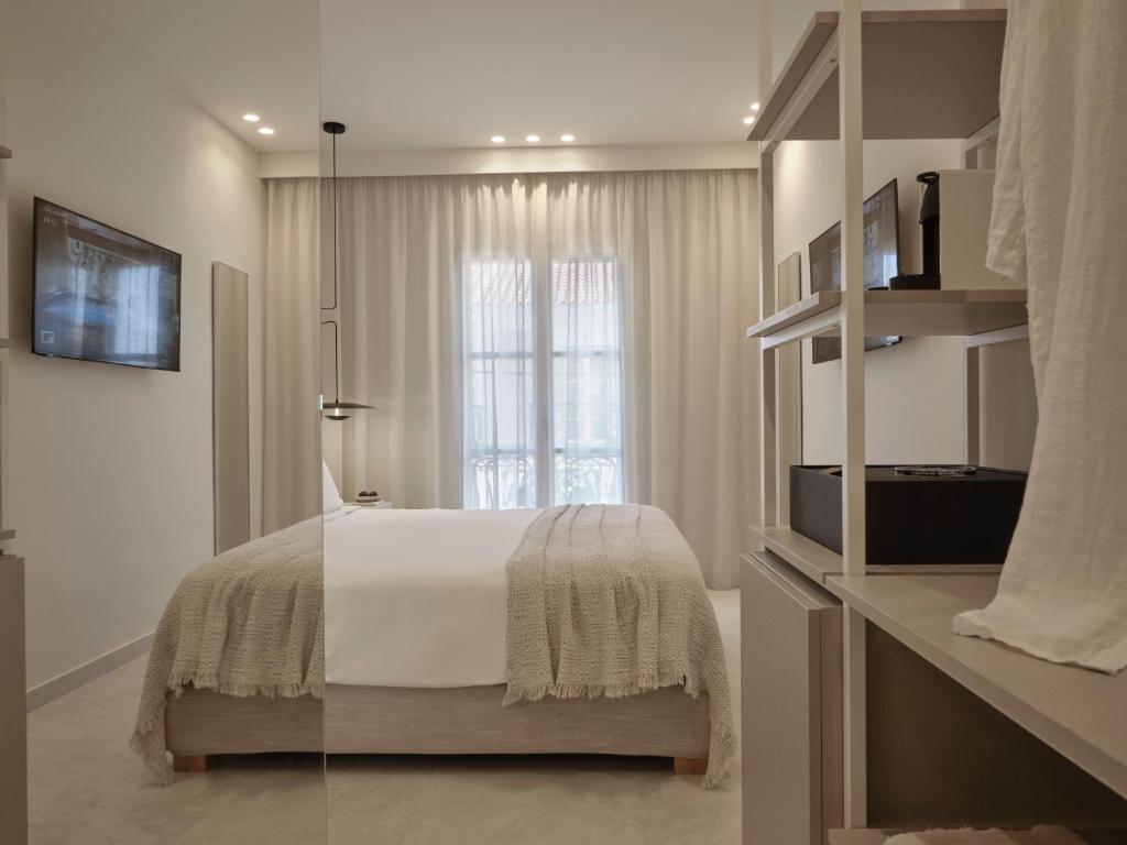 TV a/nebo společenská místnost v ubytování Doryssa Method Hotel