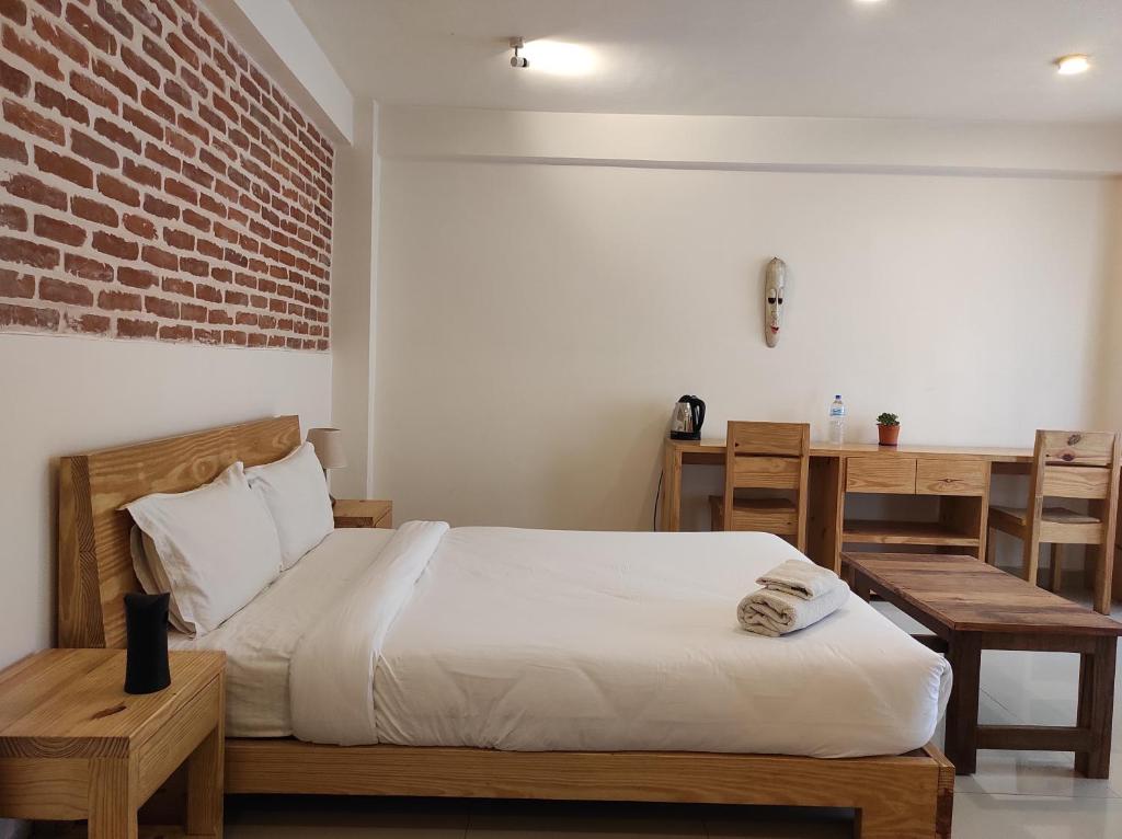 Postel nebo postele na pokoji v ubytování Sayami Home