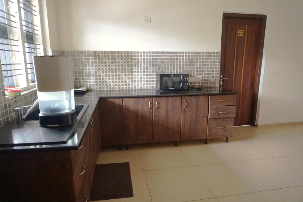 Kuchyň nebo kuchyňský kout v ubytování Stays 42 - Oleander Suites Coorg